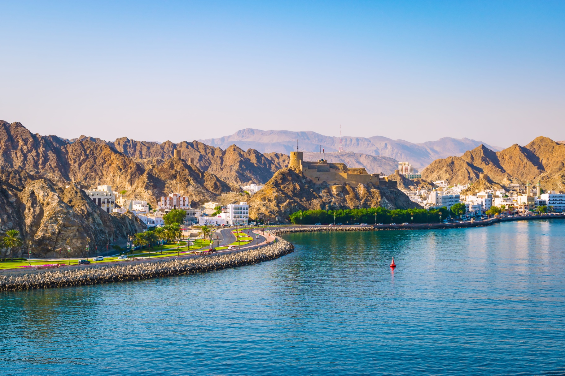 Muscat coastline and the Hajar mountains at golden hour — Sultanate of Oman